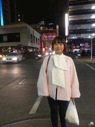 Miaomiao in front of the center east gate of Chinatown at the crossing of Little Bourke Street and Russell Street, by night