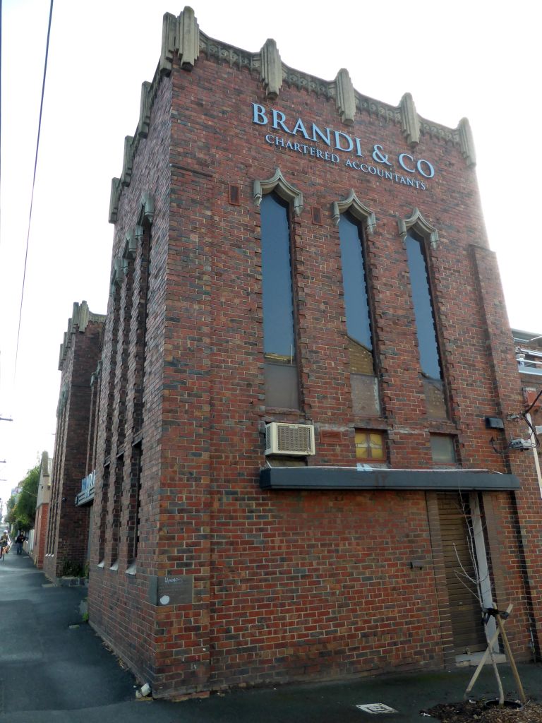 Southwest side of the Movember Headquarters Australia building at the crossing of Punt Road and the Crofts