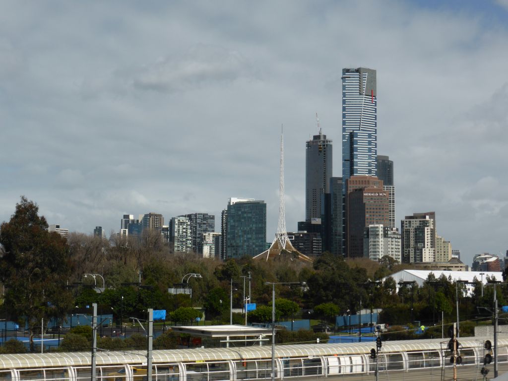 The railway, the Spire of the Arts Centre Melbourne and the Eureka Tower, viewed from the William Barak Bridge