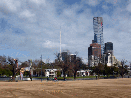 The Birrarung Marr Park with the sculpture `Angel` by Deborah Halpern, the Spire of the Arts Centre Melbourne and the Eureka Tower