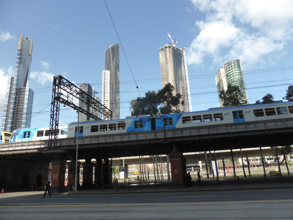 Flinders Street, the railway over William Street, the Eureka Tower and other skyscrapers