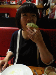 Miaomiao having pastry at the Aix Café at Centre Place