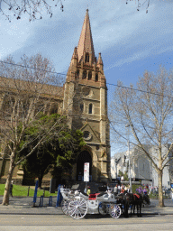 Horses and carriage in front of St. Paul`s Cathedral at Swanston Street