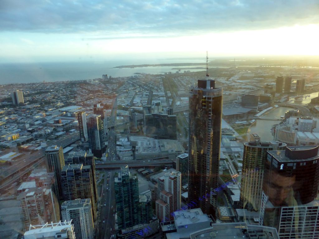 The southwest side of the city with the Prima Pearl Tower, the Melbourne Convention and Exhibition Centre, the Seafarers Bridge and the Charles Grimes Bridge over the Yarra River, the Port of Melbourne and Hobsons Bay, viewed from the Skydeck 88 of the Eureka Tower