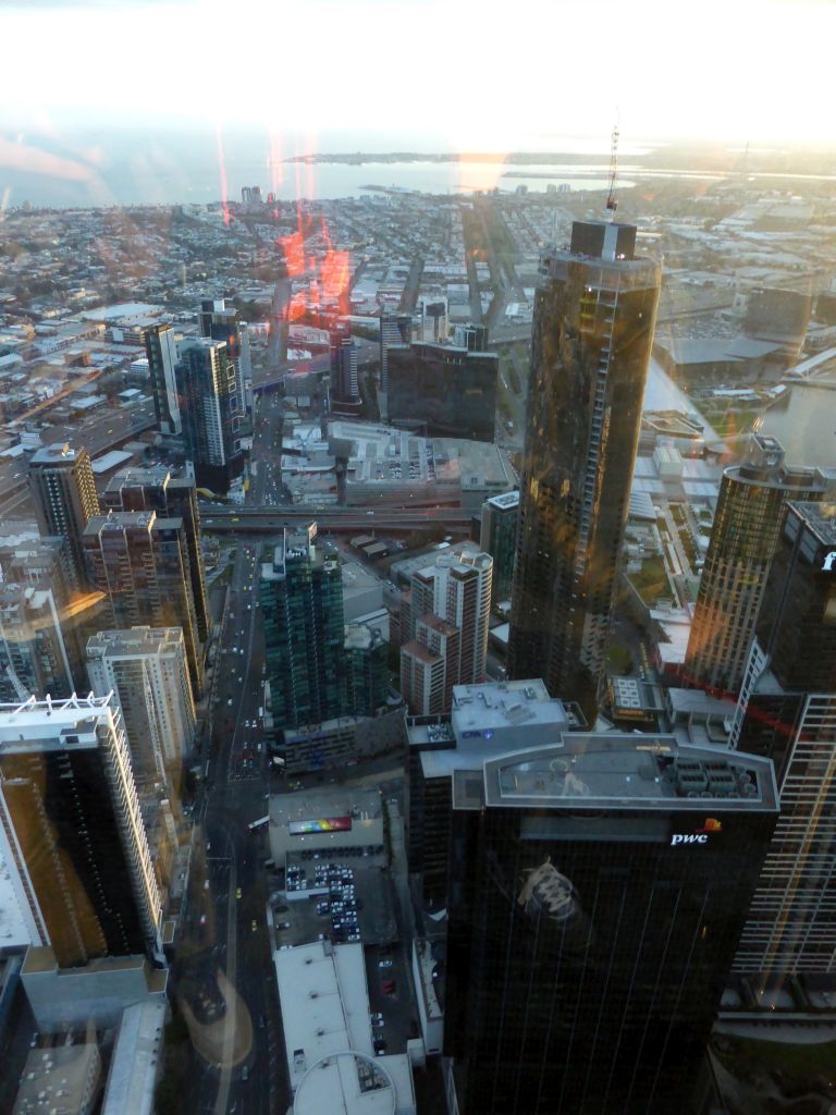 The southwest side of the city with the Freshwater Place building, the Prima Pearl Tower, the Crown Towers, the Port of Melbourne and Hobsons Bay, viewed from the Skydeck 88 of the Eureka Tower