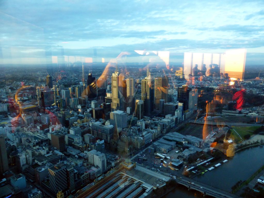 Skyscrapers at the city center, the Flinders Street Railway Station, St. Paul`s Cathedral and Federation Square with the Australian Centre for the Moving Image, viewed from the Skydeck 88 of the Eureka Tower