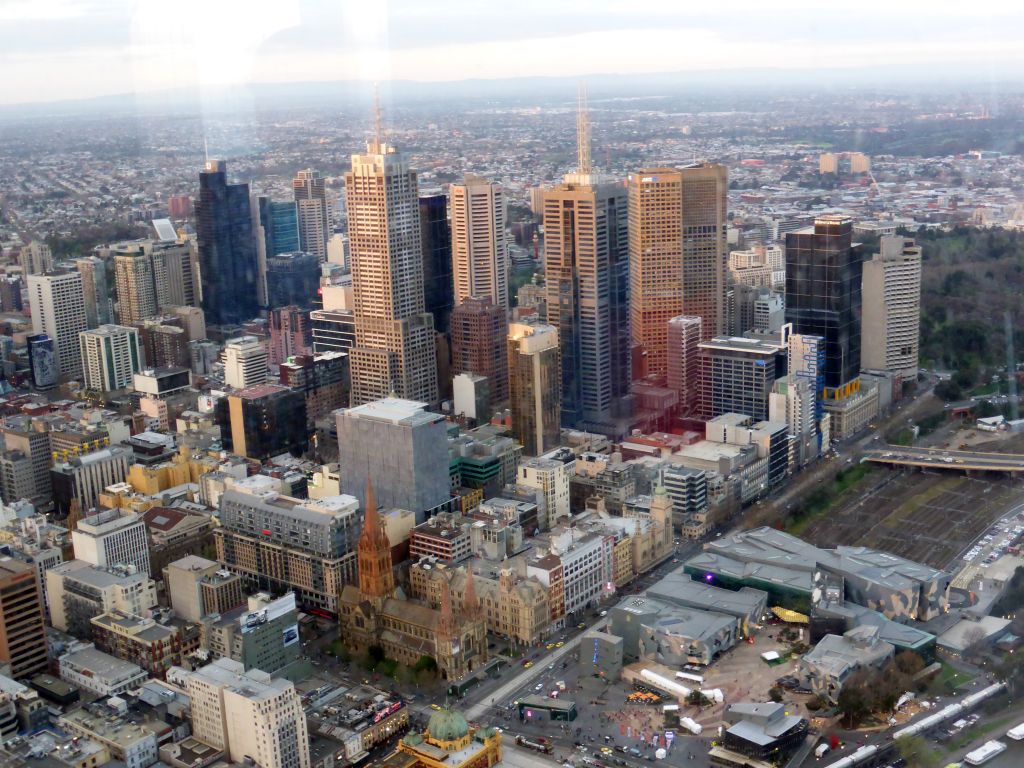 Skyscrapers at the city center, the Flinders Street Railway Station, St. Paul`s Cathedral and Federation Square with the Australian Centre for the Moving Image, viewed from the Skydeck 88 of the Eureka Tower