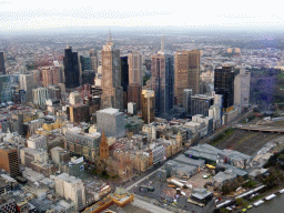 Skyscrapers at the city center, the Flinders Street Railway Station, St. Paul`s Cathedral and Federation Square with the Australian Centre for the Moving Image, viewed from the Skydeck 88 of the Eureka Tower