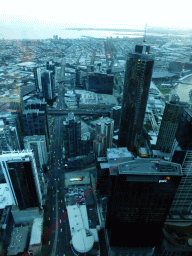 The southwest side of the city with the Freshwater Place building, the Prima Pearl Tower, the Port of Melbourne and Hobsons Bay, viewed from the Skydeck 88 of the Eureka Tower, at sunset