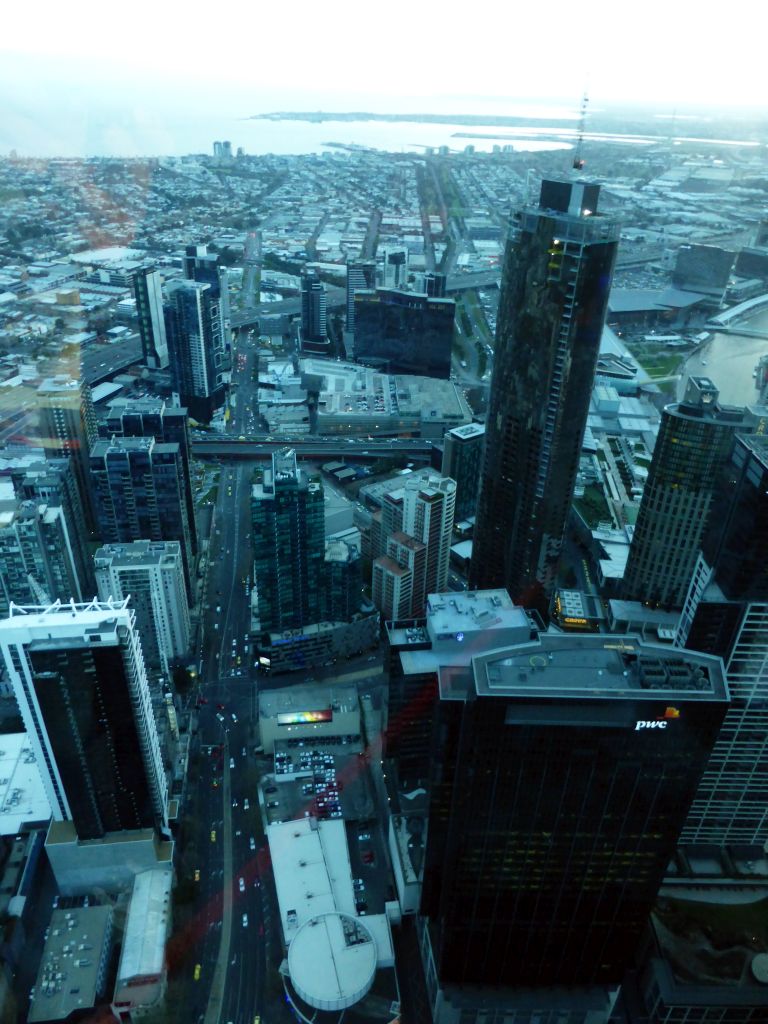 The southwest side of the city with the Freshwater Place building, the Prima Pearl Tower, the Port of Melbourne and Hobsons Bay, viewed from the Skydeck 88 of the Eureka Tower, at sunset