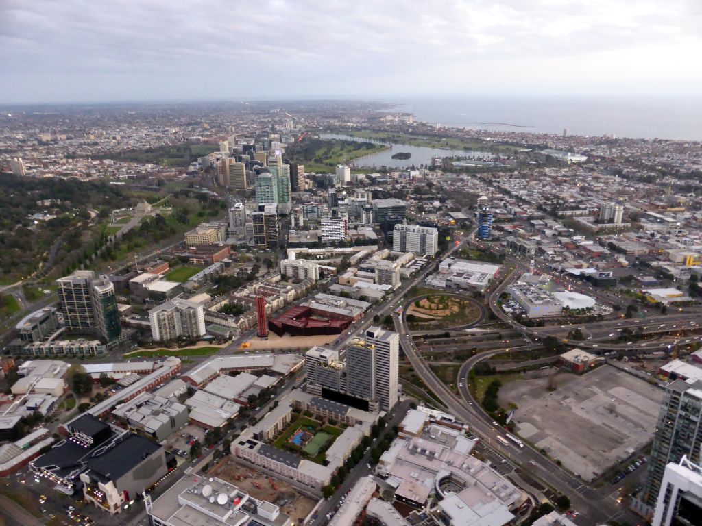 The south side of the city with the Albert Park Lake, Gunn Island, the Kings Domain, the Shrine of Remembrance, the Royal Botanic Gardens Melbourne and Hobsons Bay, viewed from the Skydeck 88 of the Eureka Tower, at sunset