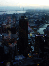 The southwest side of the city with the Prima Pearl Tower, the Port of Melbourne, the Seafarers Bridge over the Yarra River and Hobsons Bay, viewed from the Skydeck 88 of the Eureka Tower, at sunset