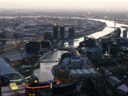 The west side of the city with Batman`s Hill, Batman Park and the Seafarers Bridge, the Charles Grimes Bridge, the Bolte Bridge and the West Gate Bridge over the Yarra River, viewed from the Skydeck 88 of the Eureka Tower, at sunset