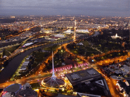 The Spire of the Arts Centre Melbourne, the National Gallery of Victoria, the Queen Victoria Gardens, the Kings Domain, the Government House, the Melbourne Cricket Ground, the Rod Laver Arena, Melbourne Park, the Hisense Arena, the AAMI Park, the Fitzroy Gardens and the Yarra River, viewed from the Skydeck 88 of the Eureka Tower, at sunset