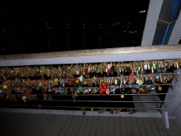 Locks at the Southgate pedestrian bridge over the Yarra River, by night