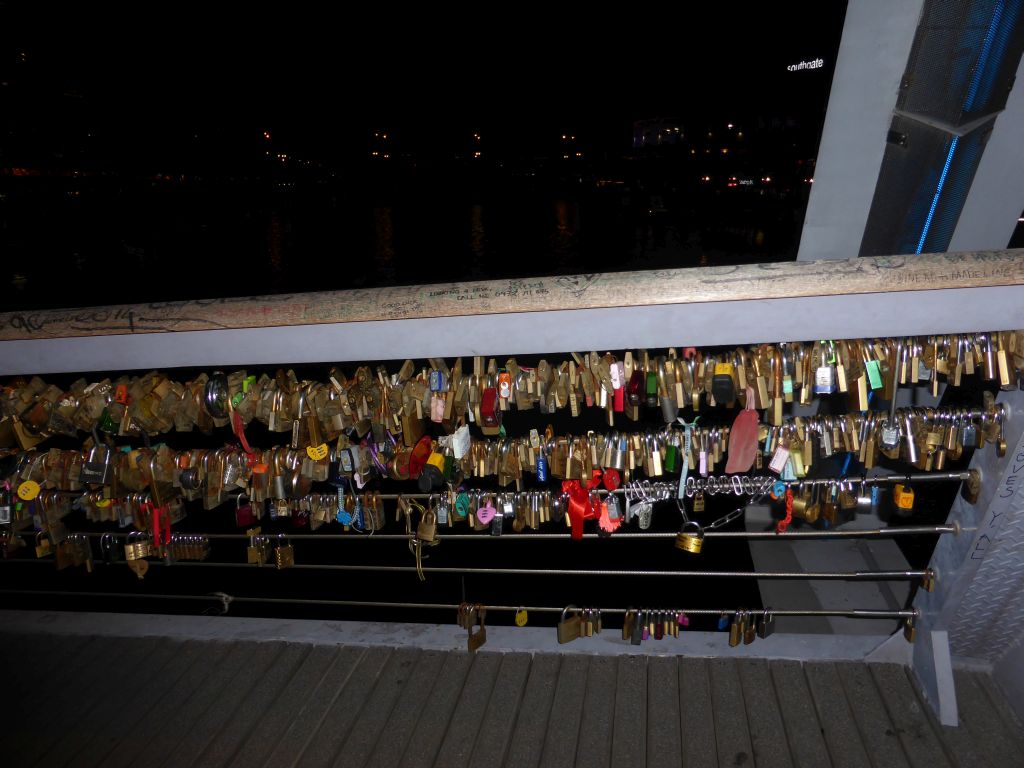 Locks at the Southgate pedestrian bridge over the Yarra River, by night