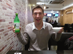 Tim with a bottle of Soju at the Kim Chi Tray restaurant at Flinders Court