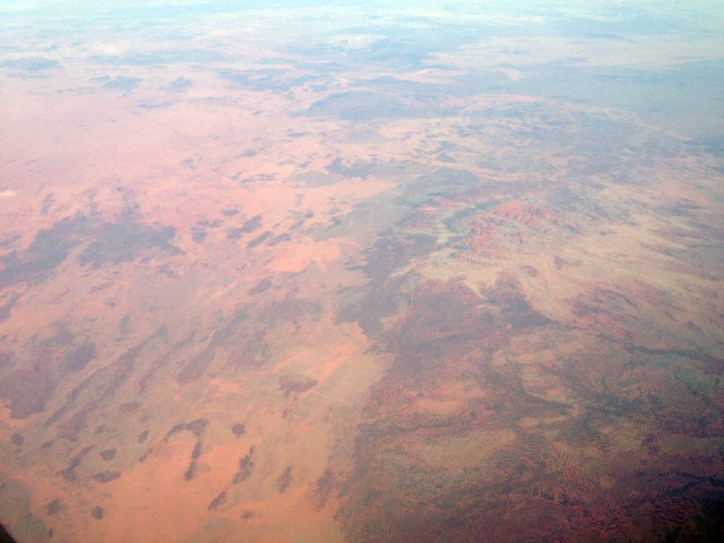 The Uluru-Kata Tjuta National Park with Mount Olga, viewed from the airplane to Bali