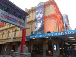 The crossing of Little Bourke Street and Exhibition Street with the east gate of Chinatown and the front of Her Majesty`s Theatre