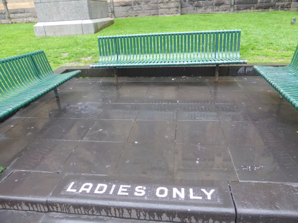 Seats with a `Ladies Only` sign at the garden at the west side of St. Paul`s Cathedral