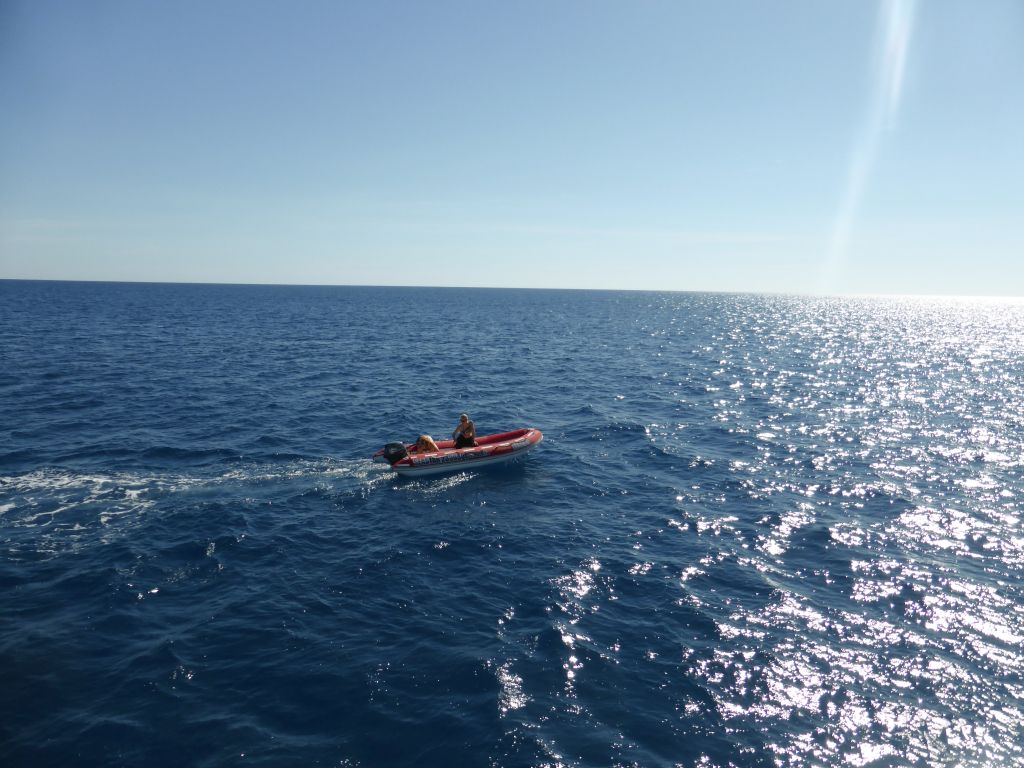 Small boat with tour guides, viewed from our Seastar Cruises tour boat