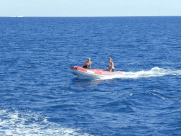 Small boat with tour guides, viewed from our Seastar Cruises tour boat