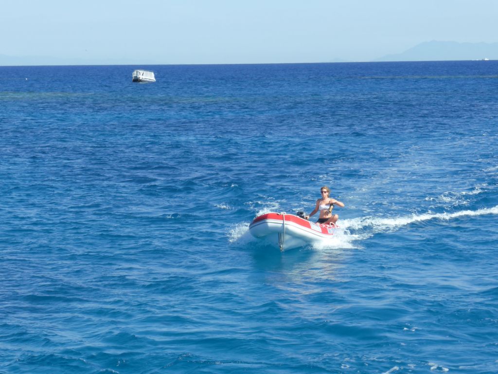 Small boat with tour guides, viewed from our Seastar Cruises tour boat