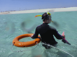 Miaomiao with snorkeling equipment in the water in front of Michaelmas Cay