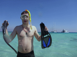 Tim with snorkeling equipment in the water in front of our Seastar Cruises tour boat