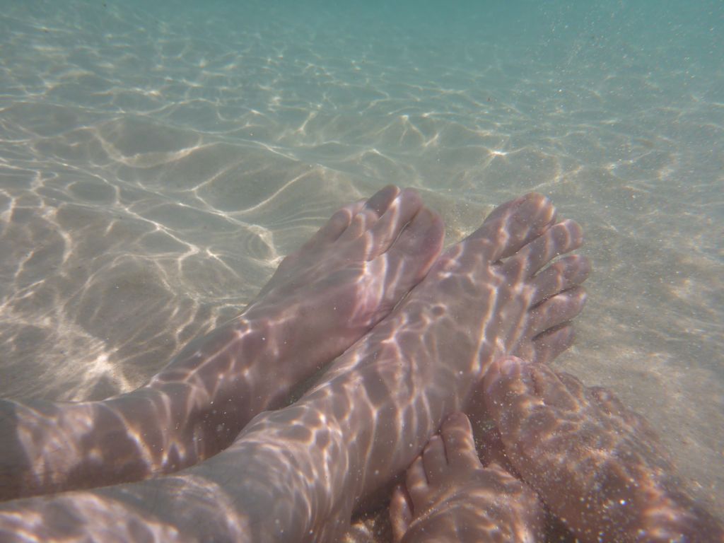 Our feet, viewed from underwater