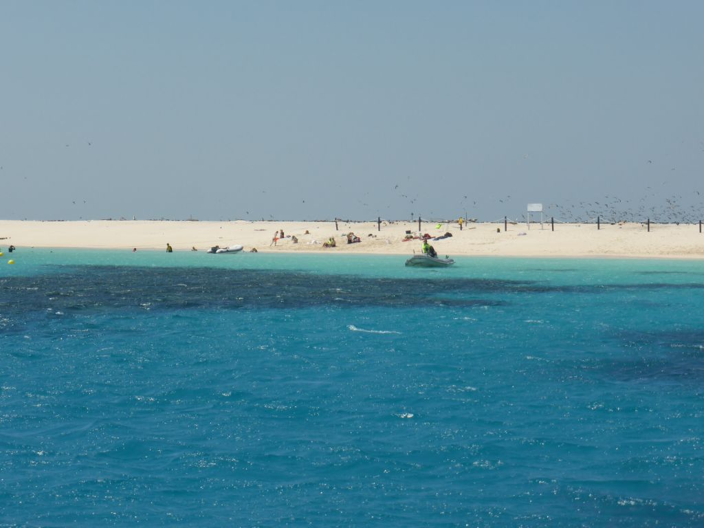 Small boats and snorkelers at Michaelmas Cay