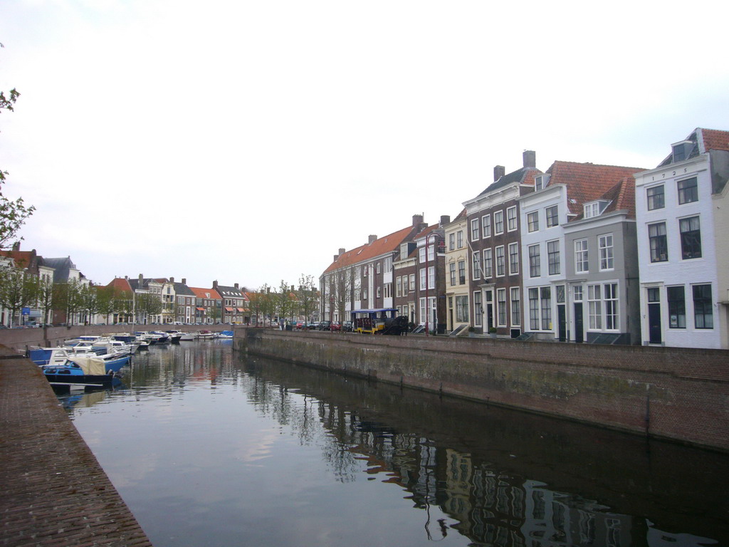 The Dam street, a canal with boats and a horse tram