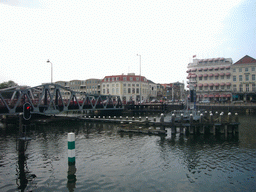 View from the Central Station on the Stationsstraat, a bridge over the Canal through Walcheren, and the Grand Hotel du Commerce