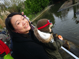 Miaomiao and Max feeding Coypus at the Dierenrijk zoo, during the `Toer de Voer` tour