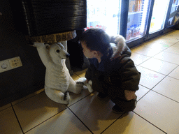 Max with a statue of a Polar Bear at Restaurant Smulrijk at the Dierenrijk zoo