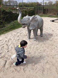 Max with a statue of an Elephant at the Dierenrijk zoo