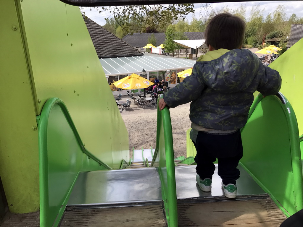 Max on top of the slide at the playground near Restaurant Smulrijk at the Dierenrijk zoo