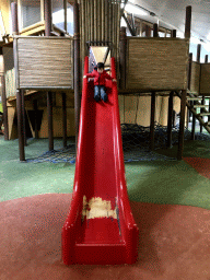 Max at a slide at the playground at the Indoor Apenkooien hall at the Dierenrijk zoo