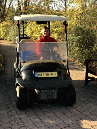 Zookeeper in a cart with animal food at the Dierenrijk zoo
