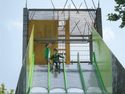 Max on a slide at the playground near Restaurant Smulrijk at the Dierenrijk zoo