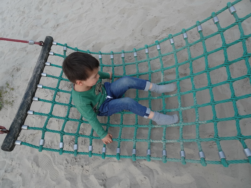 Max on a swing at the playground near Restaurant Smulrijk at the Dierenrijk zoo