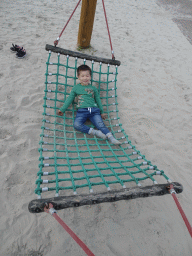 Max on a swing at the playground near Restaurant Smulrijk at the Dierenrijk zoo