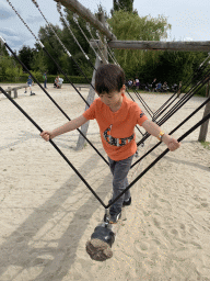 Max on a swing at the playground near Restaurant Smulrijk at the Dierenrijk zoo