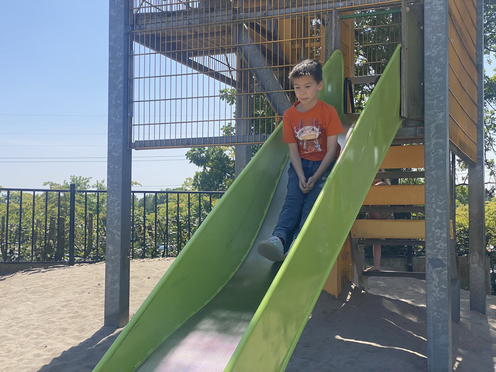 Max on a slide at the playground near Restaurant Smulrijk at the Dierenrijk zoo