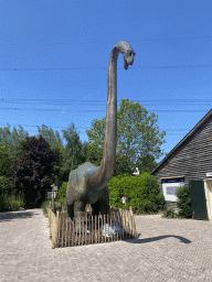 Diplodocus statue in front of the Indoor Apenkooien hall at the Dierenrijk zoo, with explanation