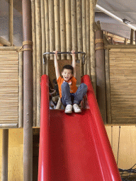 Max on a slide at the Indoor Apenkooien hall at the Dierenrijk zoo