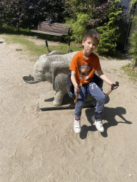 Max on a seesaw at the playground near the enclosure of the Asian Elephants at the Dierenrijk zoo