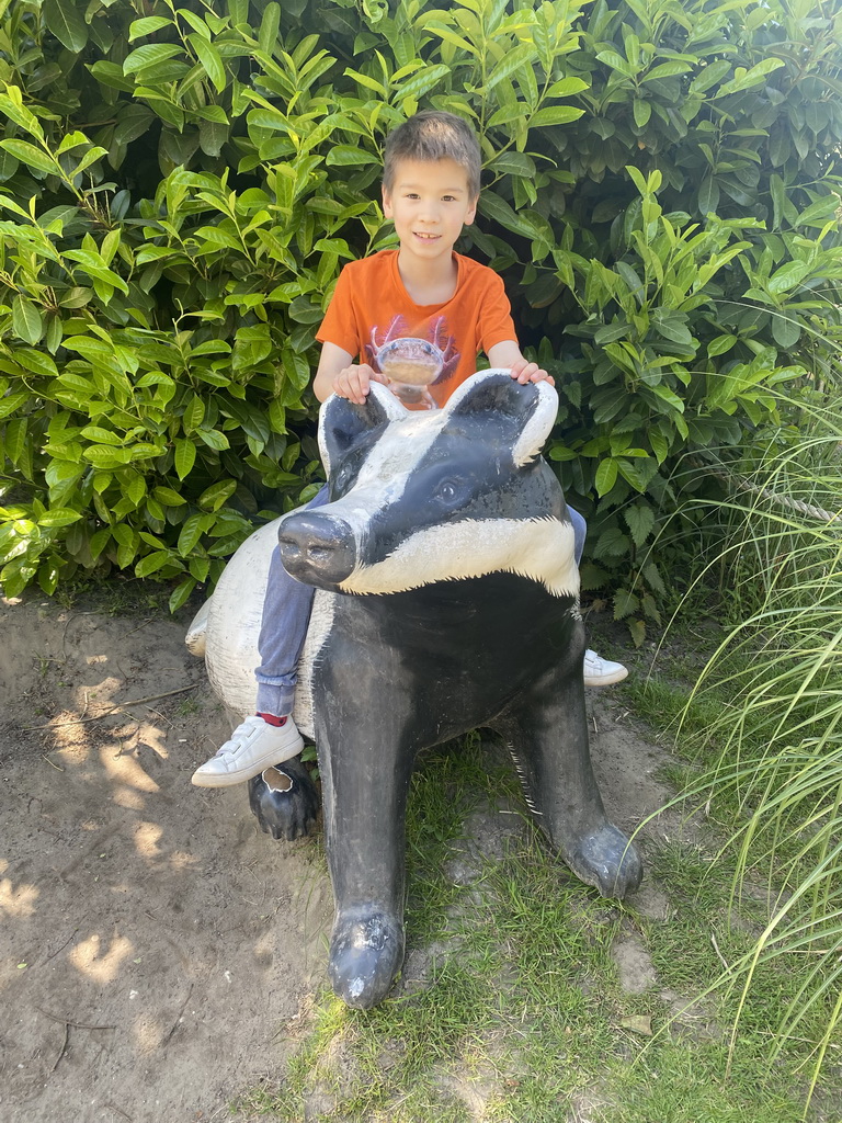 Max on a Badger statue at the Dierenrijk zoo