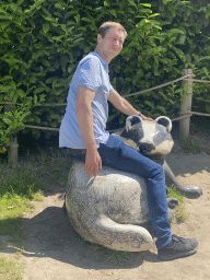 Tim on a Badger statue at the Dierenrijk zoo