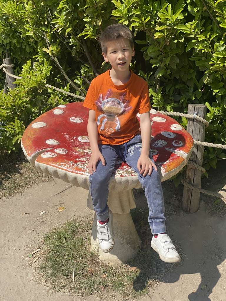 Max on a mushroom statue at the Dierenrijk zoo